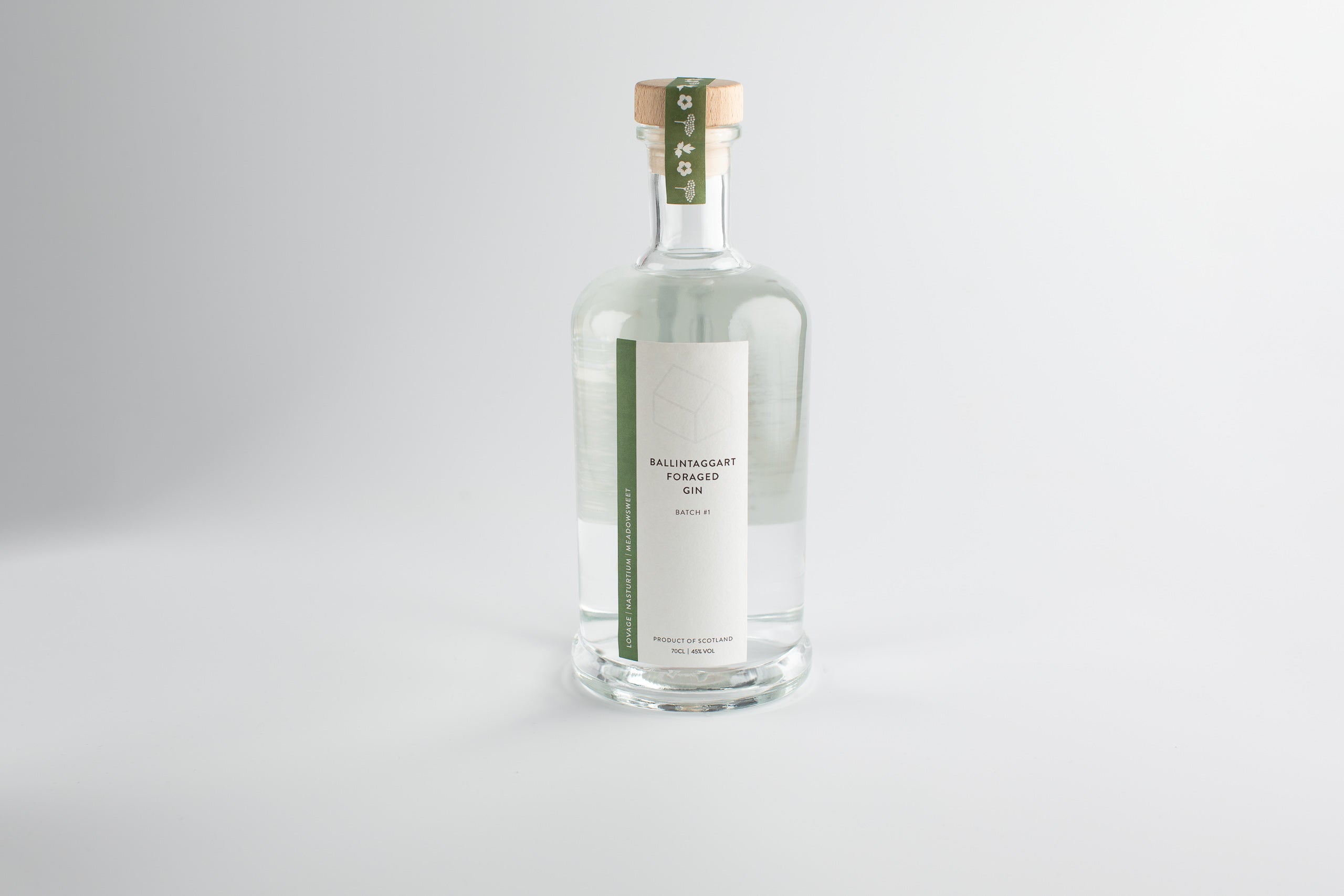 Clear glass bottle with a label on a white background