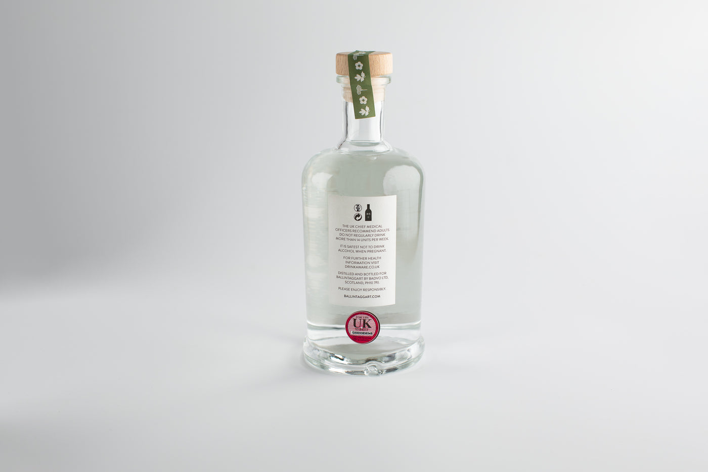 Clear bottle with a label on a white background