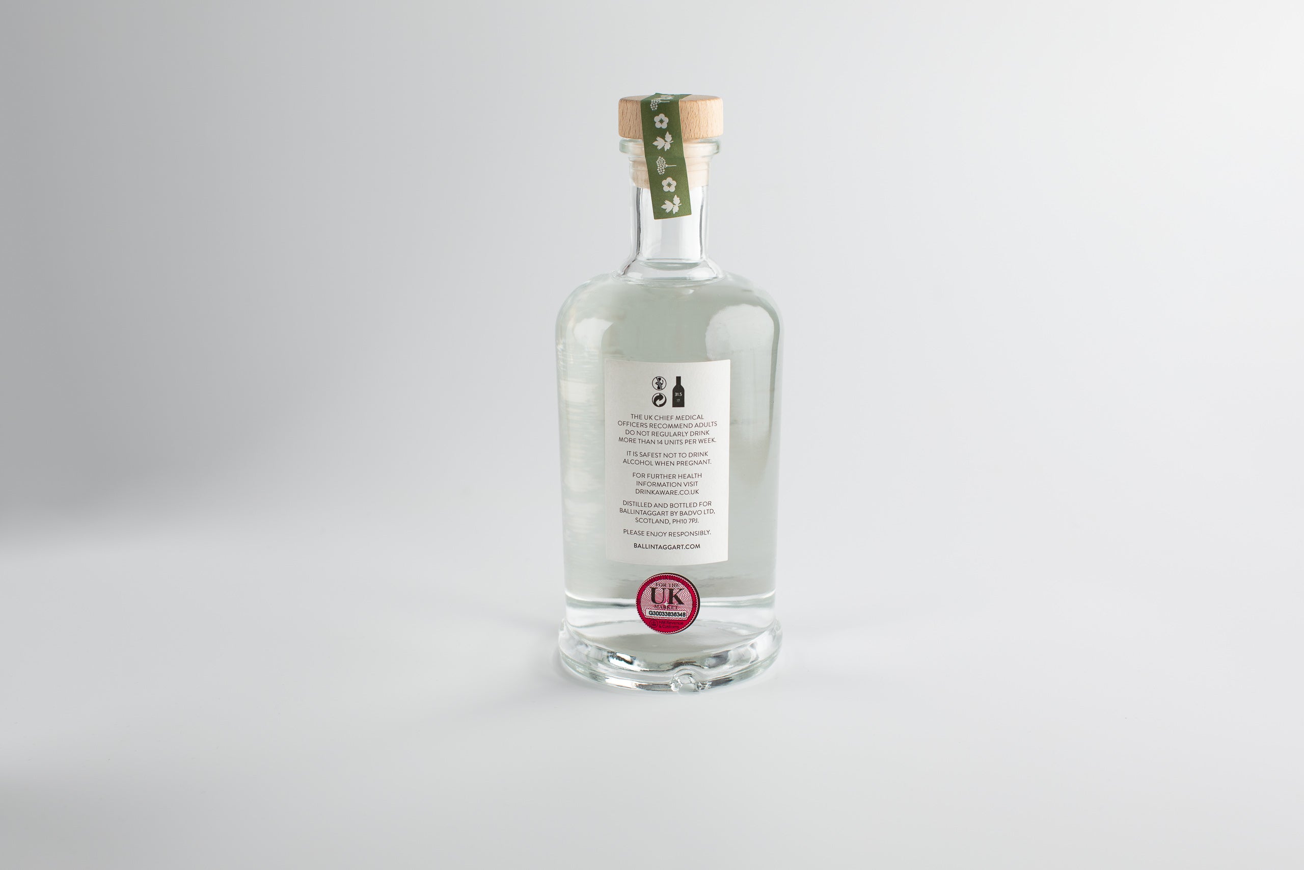 Clear bottle with a label on a white background