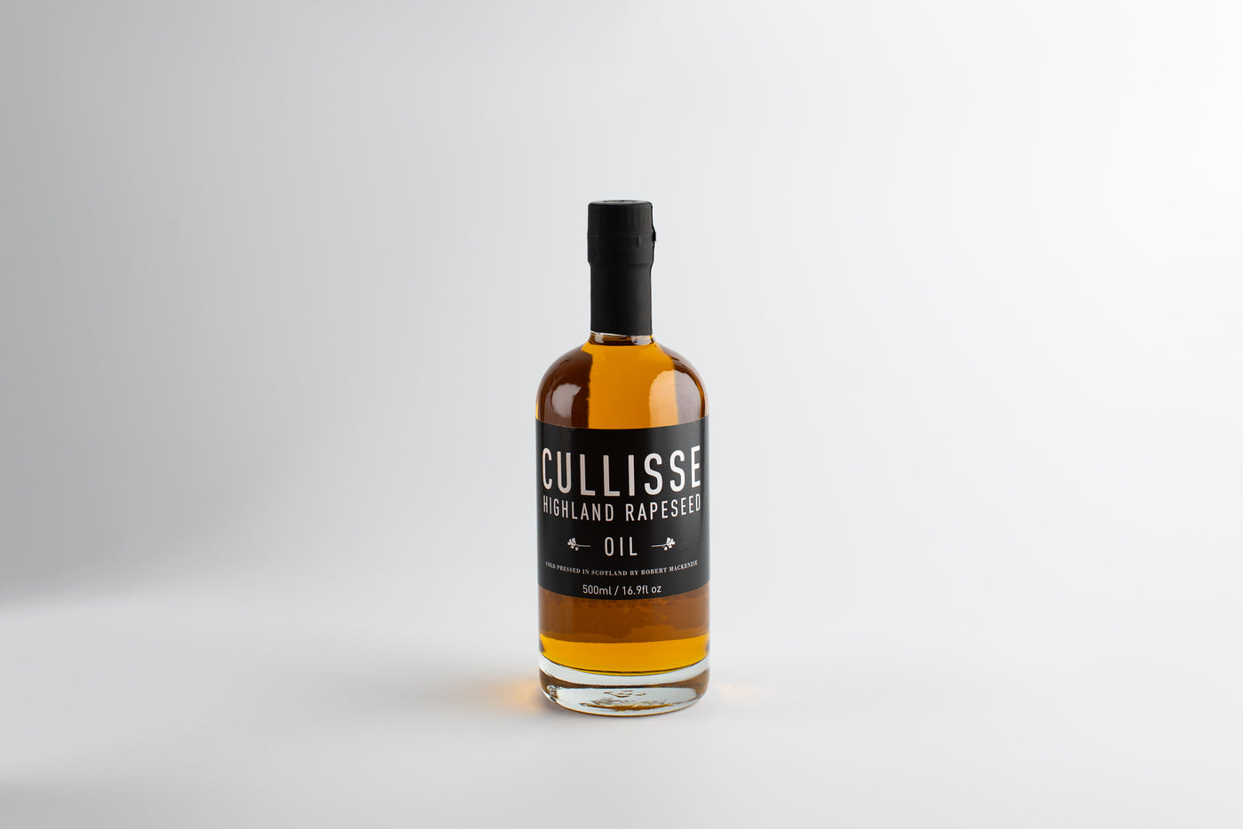 Bottle of Cullisse oil on a white background