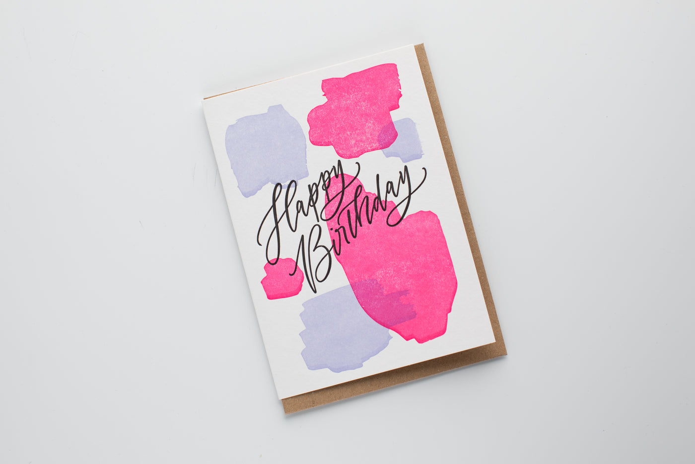 Birthday card with colorful abstract shapes on a white background