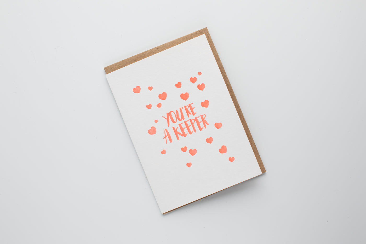 Greeting card with heart patterns and text on a white background