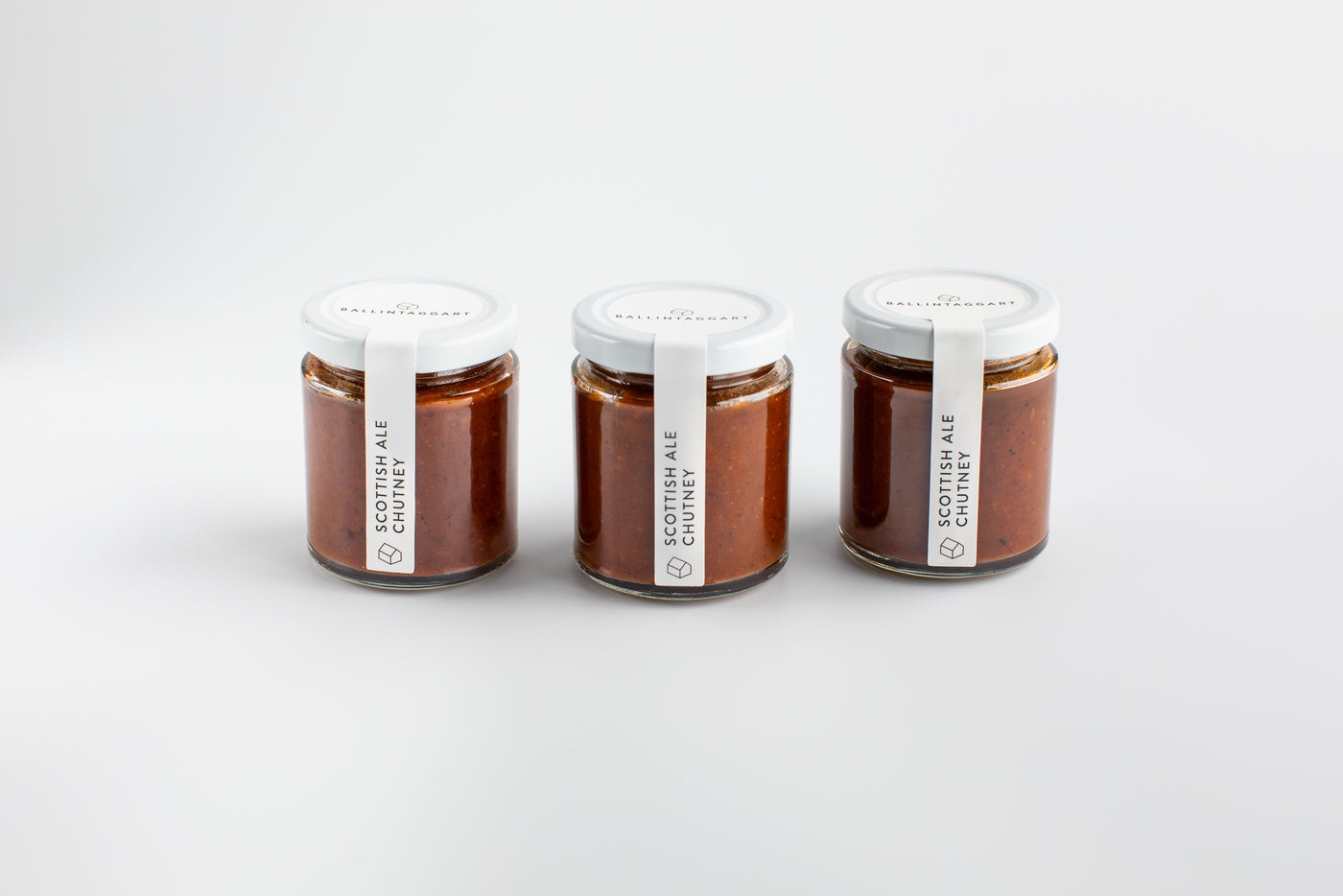 Three jars of Scottish Ale Cider on a white background