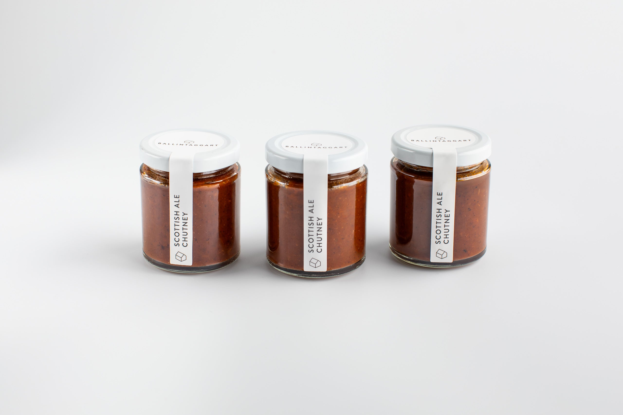 Three jars of Scottish Ale Cider on a white background